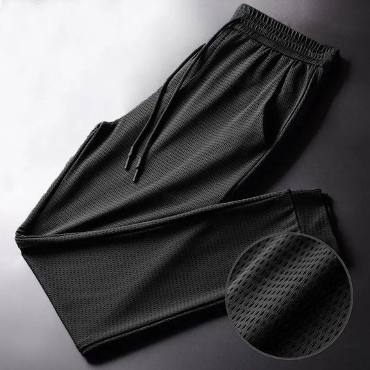 Men's Summer Ice Silk Pants Mesh Breathable Casual Thin Quick Dry Pants Loose Elastic Beam Feet Pants Sports Fitness Pants.