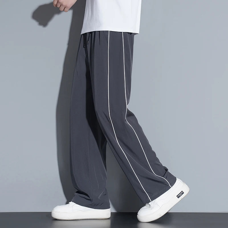 Summer ice silk thin section pants men's Hong Kong style loose splicing casual sports wide-legged pants elastic speed pants