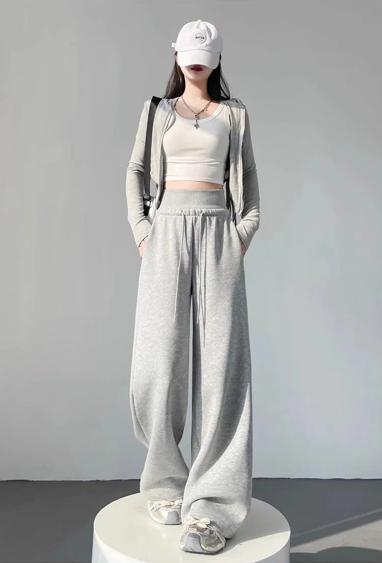 Graue Sporthose für Damen mit hoher Taille und lockerem, schlankem, geradem Bein und weitem Bein. Amerikanische Jogginghose.