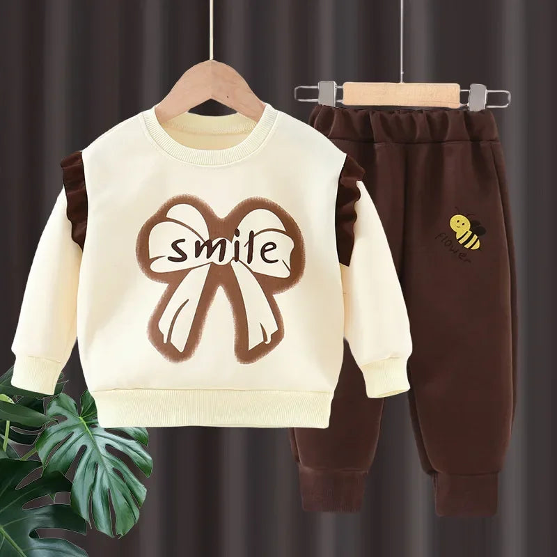 New 2025 Girls Fashion Cartoon Bowknot Letter Long Sleeve Pullover Sweatshirt + Pants Kids Spring Casual Sports Clothing Sets.