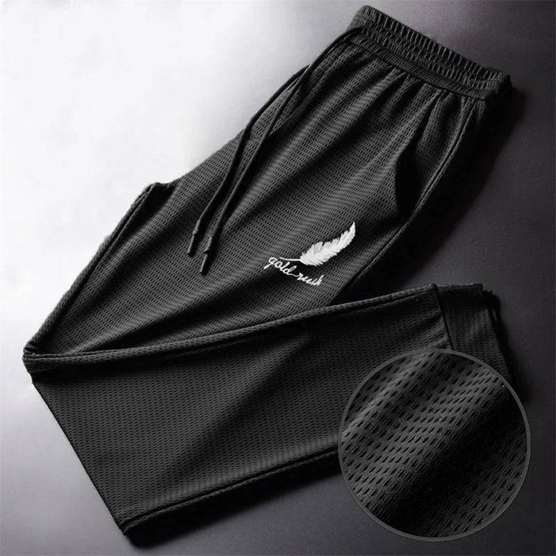 Men's Hollow Out Ice Silk Pants Mesh Breathable Casual Thin Quick Dry Pant Loose Elastic Beam Feet Pants Sports Fitness Trousers.