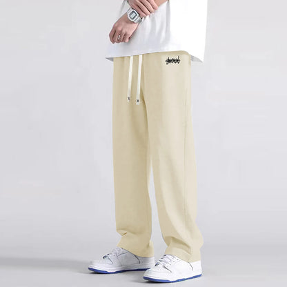Men's solid color straight leg jogging pants, suitable for casual sports such as running, gym, and outdoor activities.