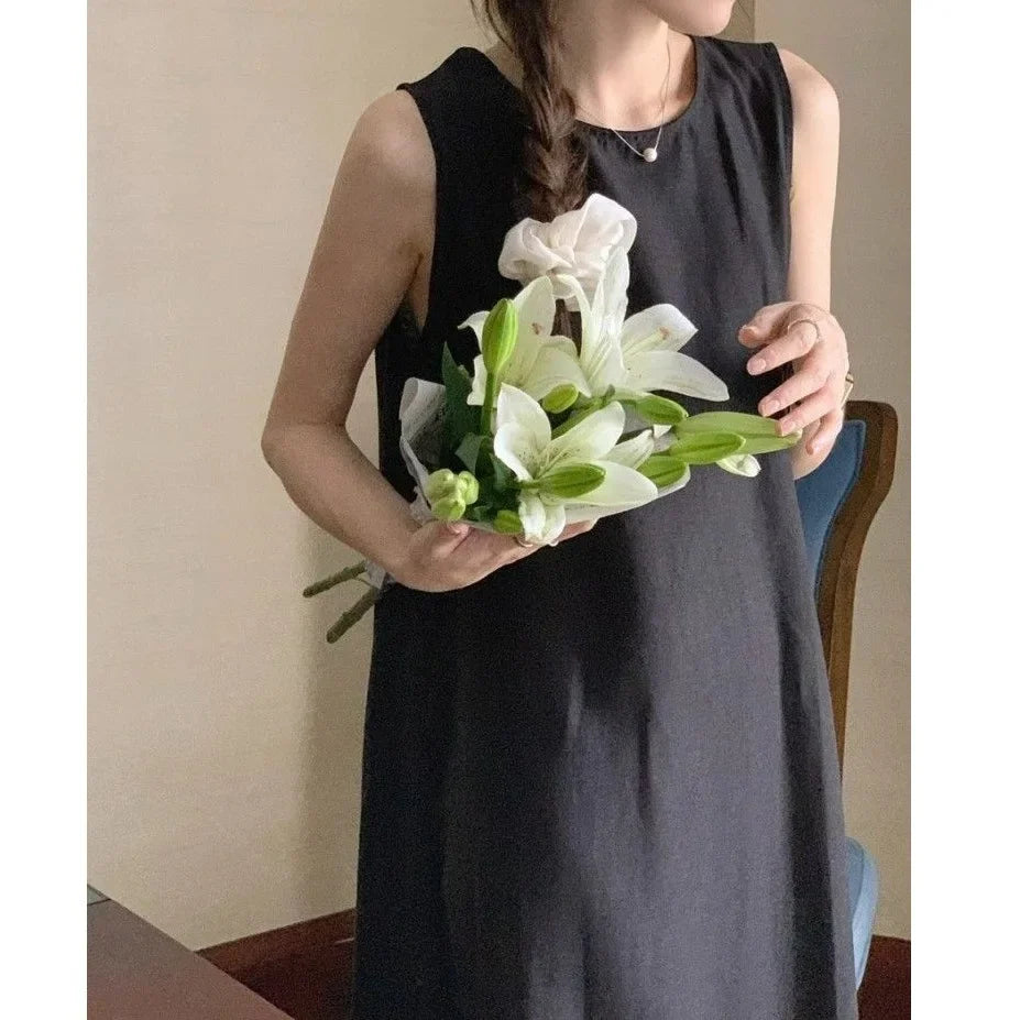 Elegantes ärmelloses langes Westenkleid für Damen, lockerer Rücken, hohles Design, Rundhalsausschnitt, Frühlingsausflugskleid, Prinzessinnenärmel, Polokragen.