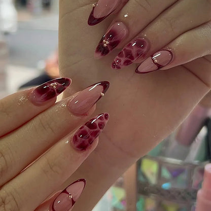 24pcs Women'S Nail Set Burgundy Almond Shape Medium Length Solid Color with Floral Golden Dust Design Fake Nails for Women/Girls.