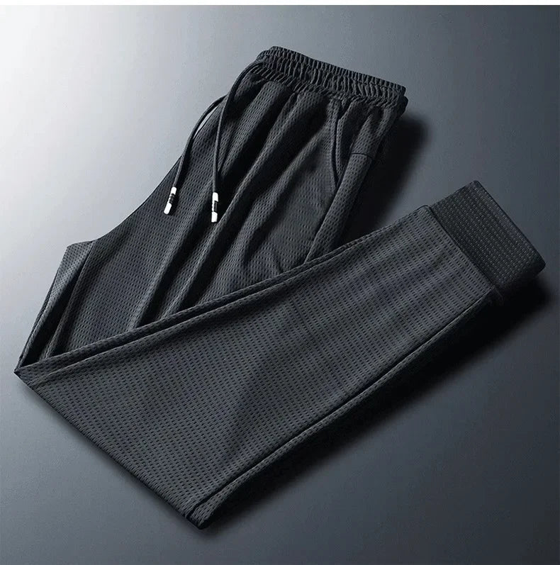 2024 New Ice Silk Pants Summer Thin Breathable Mesh Pants Men's Casual Ice Cold Men's Other Material.