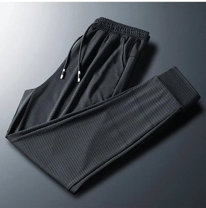 2024 New Ice Silk Pants Summer Thin Breathable Mesh Pants Men's Casual Ice Cold Men's Other Material.