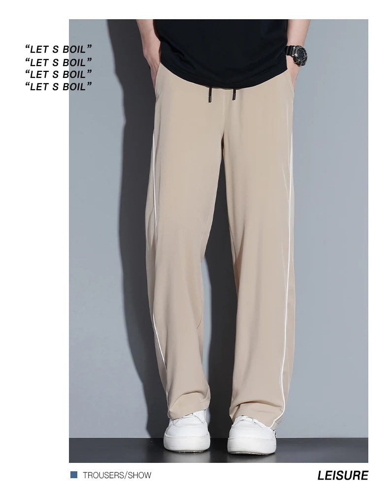 Summer ice silk thin section pants men's Hong Kong style loose splicing casual sports wide-legged pants elastic speed pants.