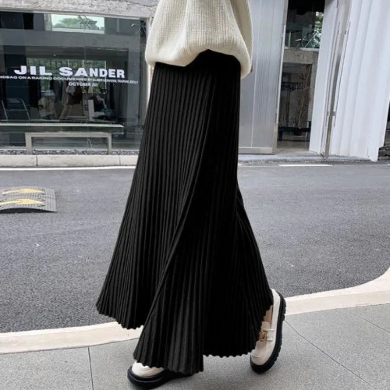 Knitted midi skirt women's A-line skirt high waist wide span mid length skirt.