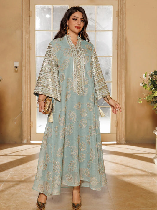Muslim Women's Light Blue Islamic Embroidered Abaya with Gold Detailing Ideal for Formal Events in Middle East like UAE Saudi.