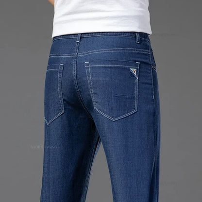 Summer Ultra Thin Men's Loose Jeans Lyocell Ice Silk Fashion Casual Business Denim Pants Straight Stretch Male Trousers.