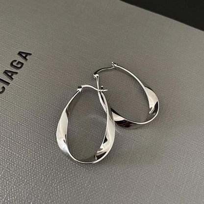 Silver Color Geometric Twisted Hoop Earrings for Women Mobius Strip Compact Earring Femininity Ear Euckle Jewelry Accessorie.