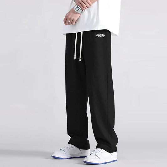 Men's solid color straight leg jogging pants, suitable for casual sports such as running, gym, and outdoor activities.