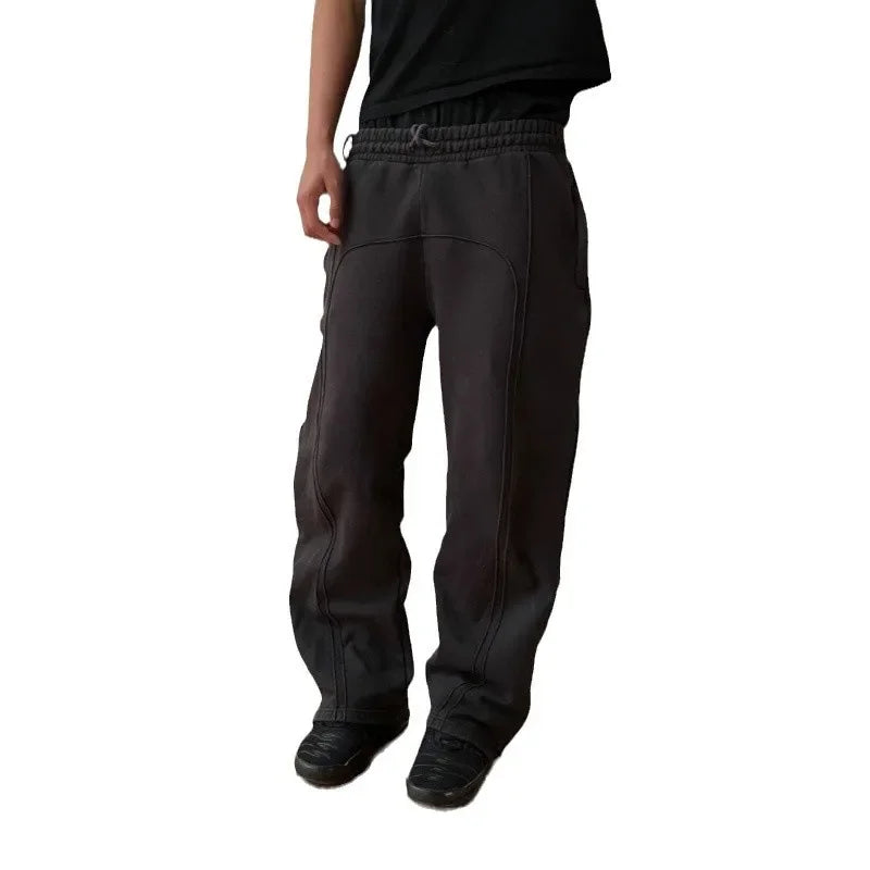 Casual Elastic Drawstring Zipper Pants High Street Hip Hop Streetwear Loose Fit Men's Trousers for Casual Scenarios.