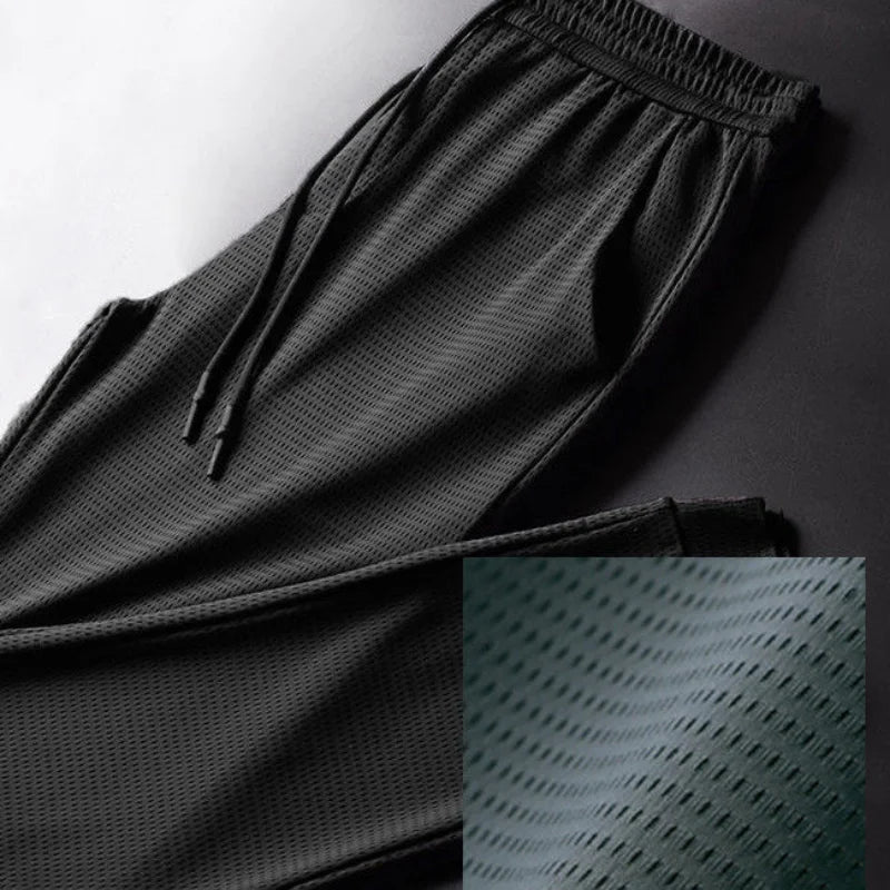 Men's Summer Ice Silk Pants Mesh Breathable Casual Thin Quick Dry Pants Loose Elastic Beam Feet Pants Sports Fitness Pants.