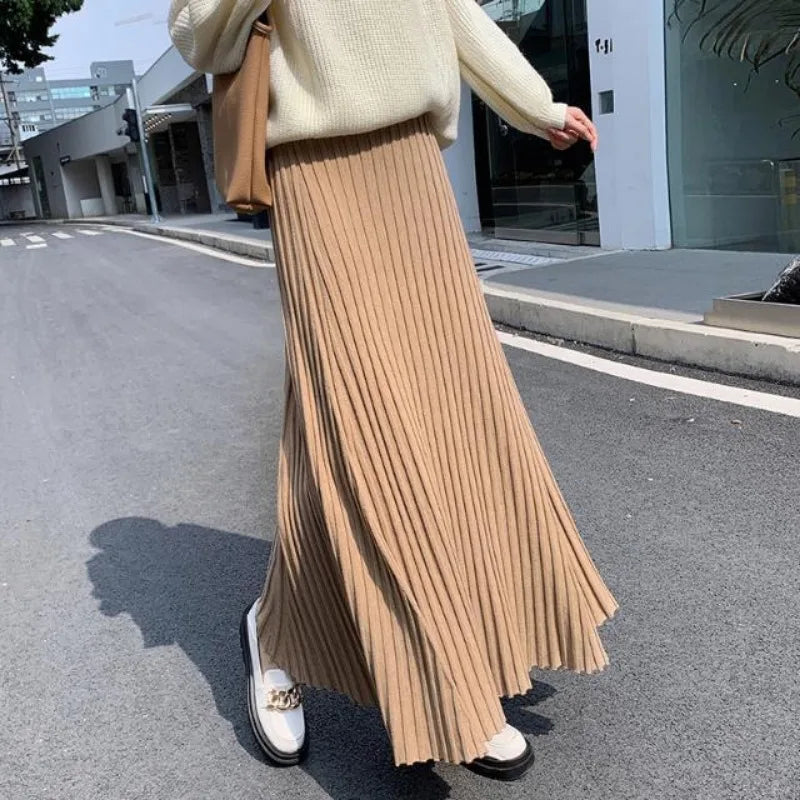 Knitted midi skirt women's A-line skirt high waist wide span mid length skirt.
