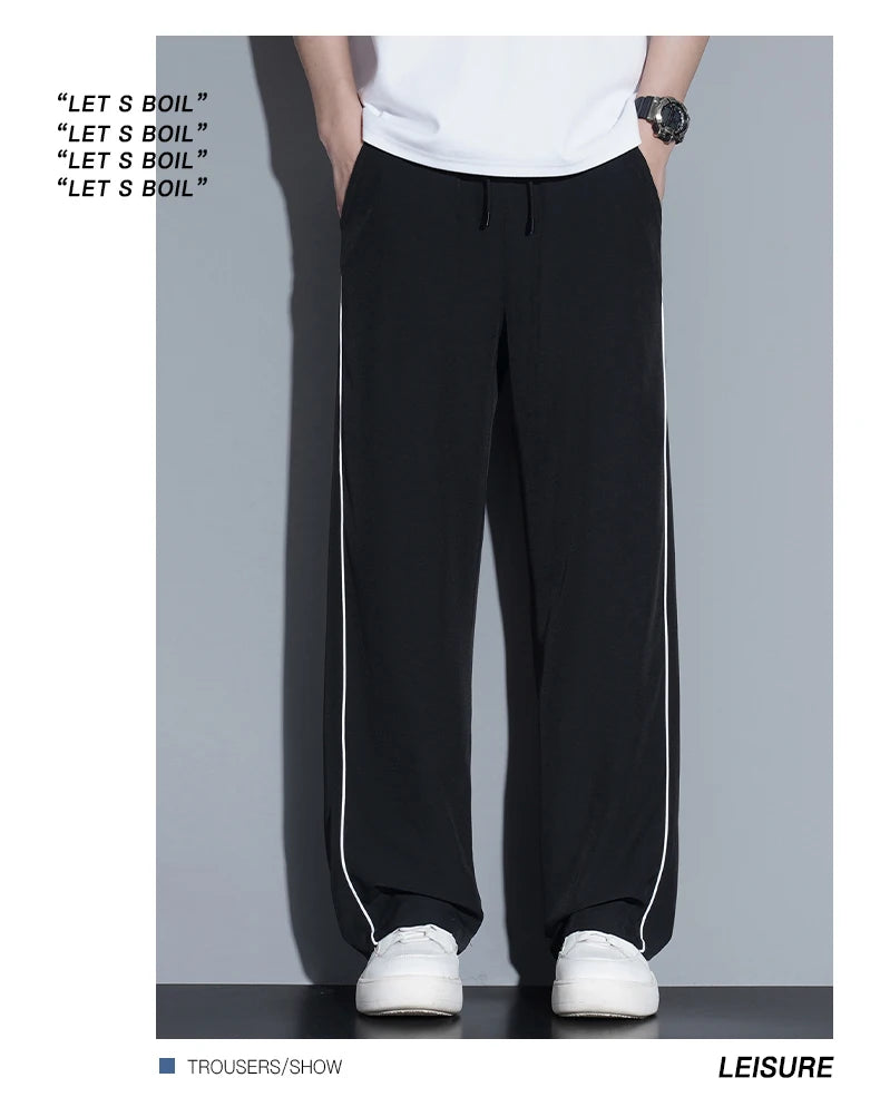 Summer ice silk thin section pants men's Hong Kong style loose splicing casual sports wide-legged pants elastic speed pants.