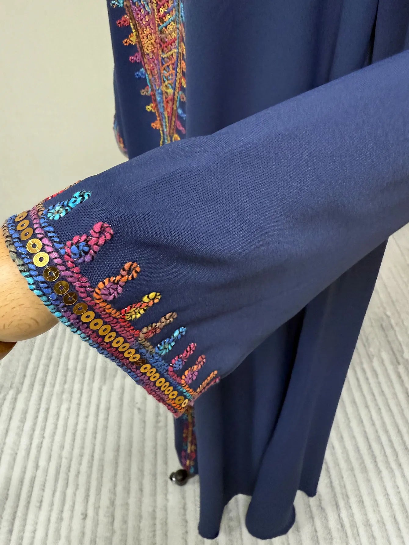 Trendy Muslim Abaya in Deep Blue Adorned with Intricate Multicolored Embroidery for Arabian Social Galas Modest Islam Fashion.