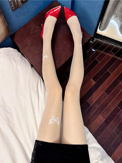 A women's ultra thin butterfly print pantyhose Fashion Spice sexy transparent stretch tights.