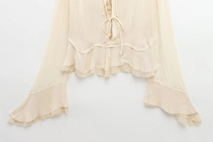 New spring women's clothing European and American style ruffled edge lace-up fake two-piece layered trumpet sleeve shirt.