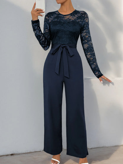 Woman Black Lace Sleeve Jumpsuit Round Neck Belted Waist Ideal for Evening Parties and Cocktail Events.