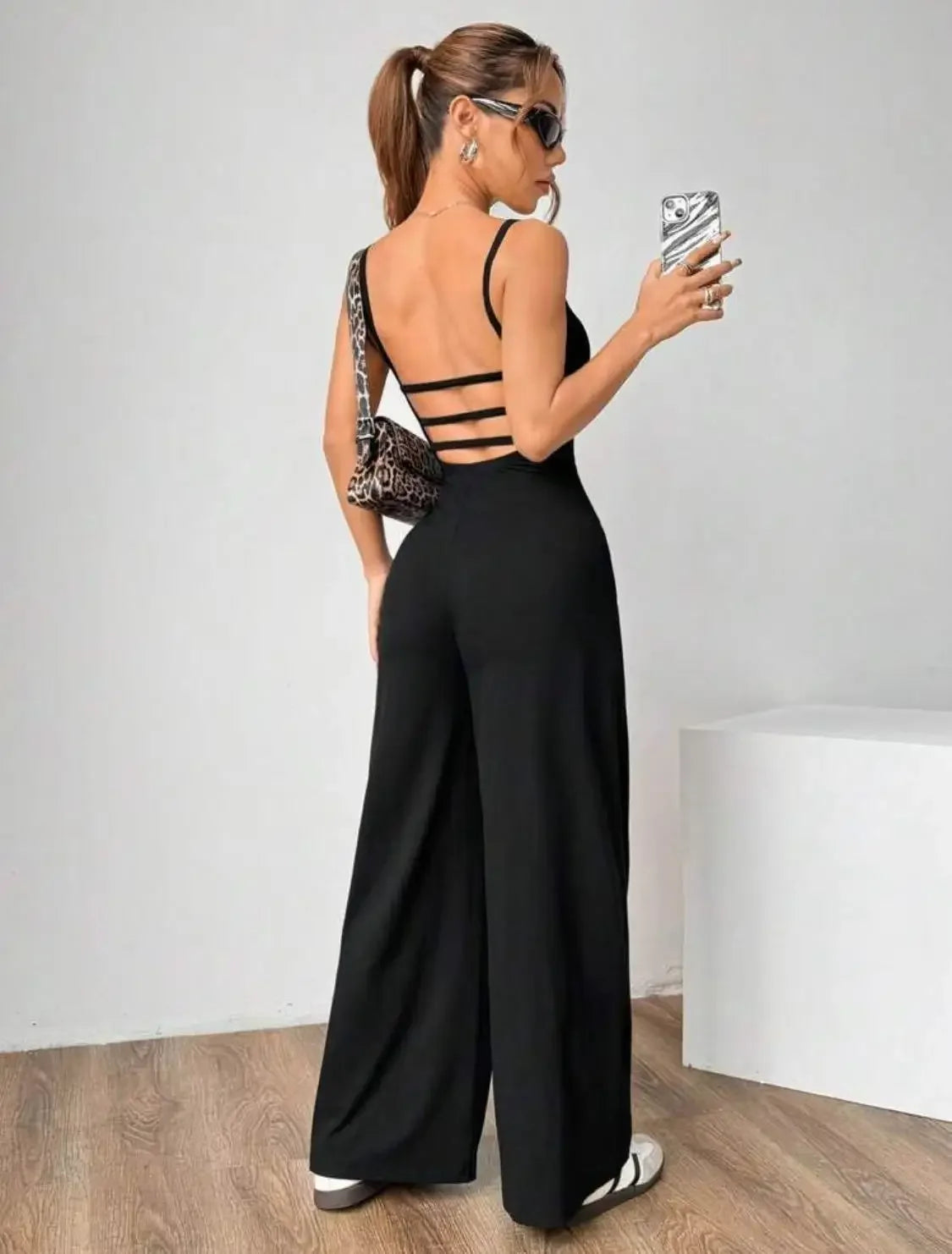 Fashionable Solid Color High Waist Bell Bottom Jumpsuit Backless Strap Casual Women's Long Pants One Piece Suit Female.