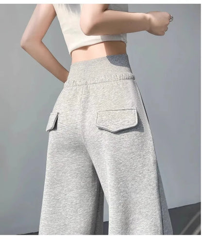 Graue Sporthose für Damen mit hoher Taille und lockerem, schlankem, geradem Bein und weitem Bein. Amerikanische Jogginghose.