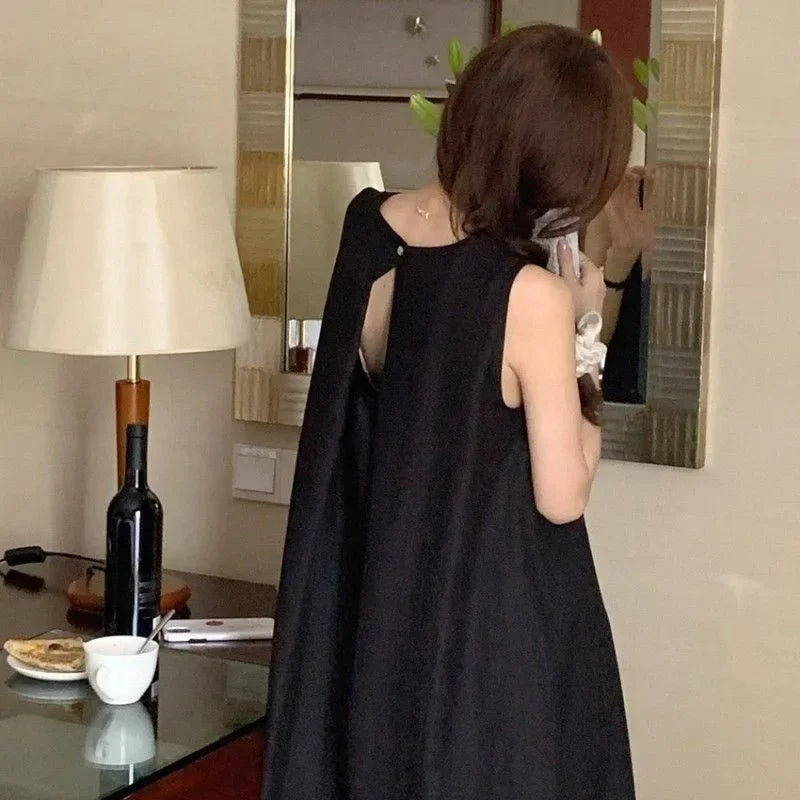 Elegantes ärmelloses langes Westenkleid für Damen, lockerer Rücken, hohles Design, Rundhalsausschnitt, Frühlingsausflugskleid, Prinzessinnenärmel, Polokragen.
