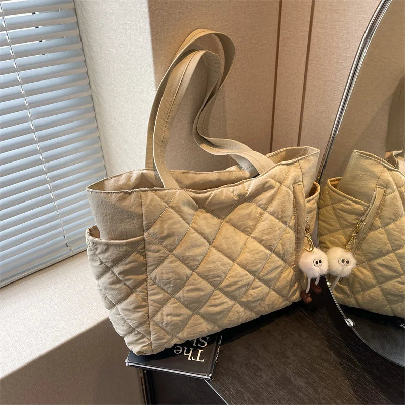 Black Large Capacity Handbag with Square Pattern, Durable Quilted Material, Multiple Pockets for Easy Storage & Cute Plush Charm.