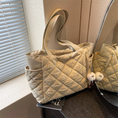 Black Large Capacity Handbag with Square Pattern, Durable Quilted Material, Multiple Pockets for Easy Storage & Cute Plush Charm.