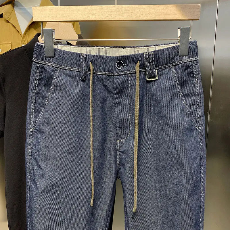 Frühling Herbst neue Mode einfarbige elastische Taille Jeans Herren bekleidung Kordel zug Taschen Chaopai lässig lose gerade Hosen.