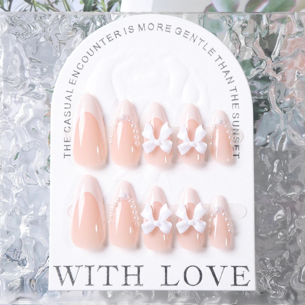 24pcs(+Tools) Pearl Bow Nude Pink Press On Nails White French Fingertips Almond Full Cover Fasle Nails New Year Nail Accessories.
