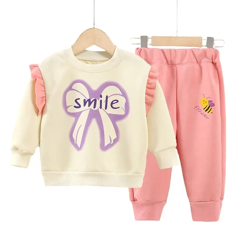 New 2025 Girls Fashion Cartoon Bowknot Letter Long Sleeve Pullover Sweatshirt + Pants Kids Spring Casual Sports Clothing Sets.