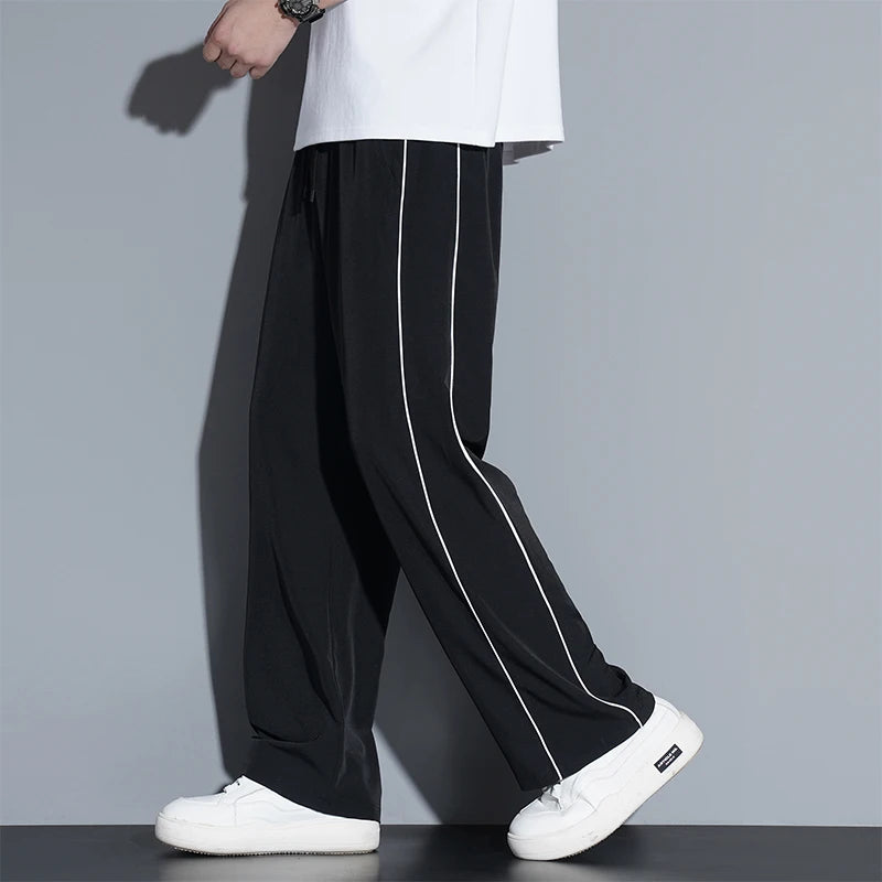 Summer ice silk thin section pants men's Hong Kong style loose splicing casual sports wide-legged pants elastic speed pants