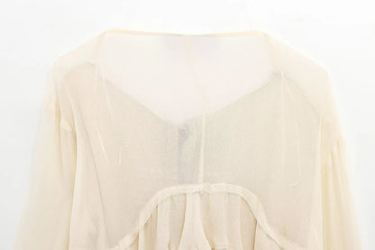 New spring women's clothing European and American style ruffled edge lace-up fake two-piece layered trumpet sleeve shirt.