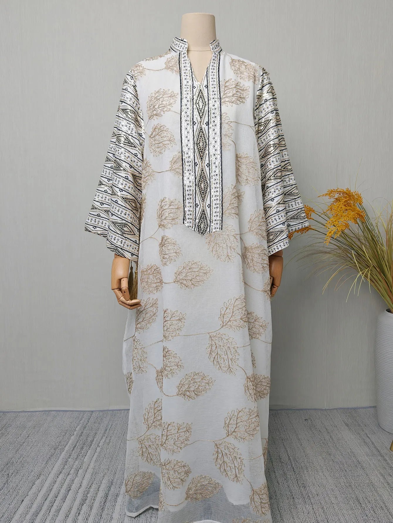 Muslim Women's Light Blue Islamic Embroidered Abaya with Gold Detailing Ideal for Formal Events in Middle East like UAE Saudi.