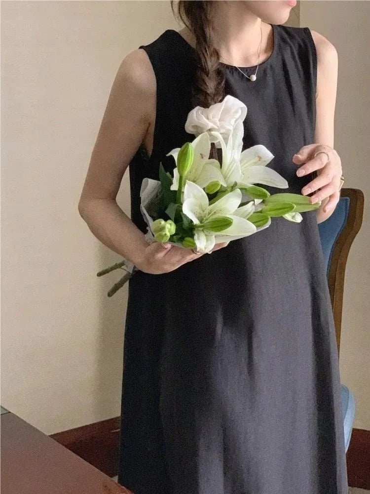 Elegantes ärmelloses langes Westenkleid für Damen, lockerer Rücken, hohles Design, Rundhalsausschnitt, Frühlingsausflugskleid, Prinzessinnenärmel, Polokragen.