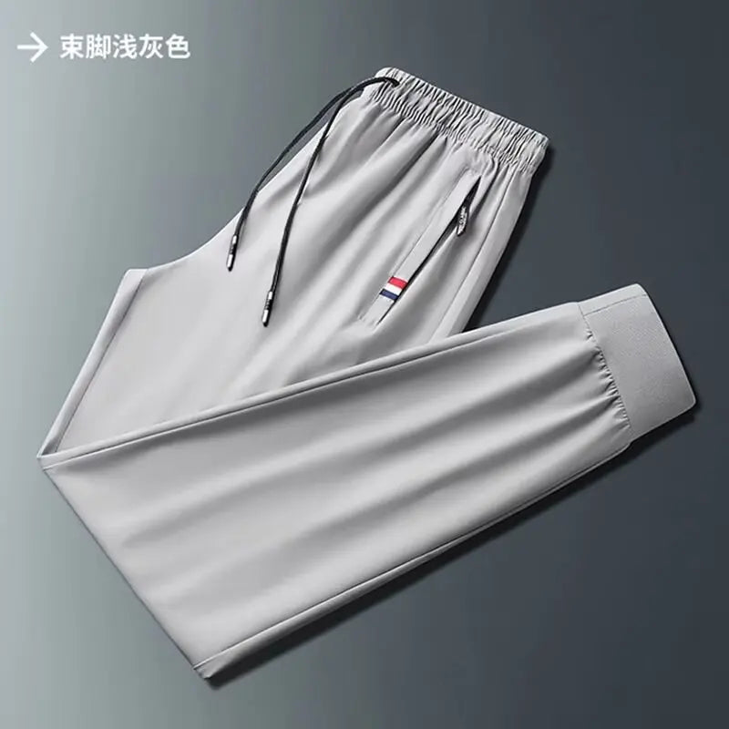 Men's Quick Dry Loose Fit Breathable Summer Lightweight Casual Pants Korean Style Elastic Sweatpants For Men.