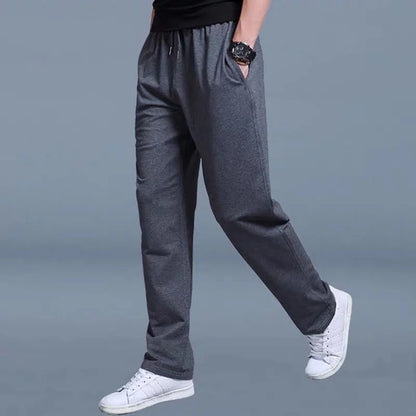 Men's solid color pants summer ice silk elastic quick drying loose sports pants suitable for casual and business wear ﻿.