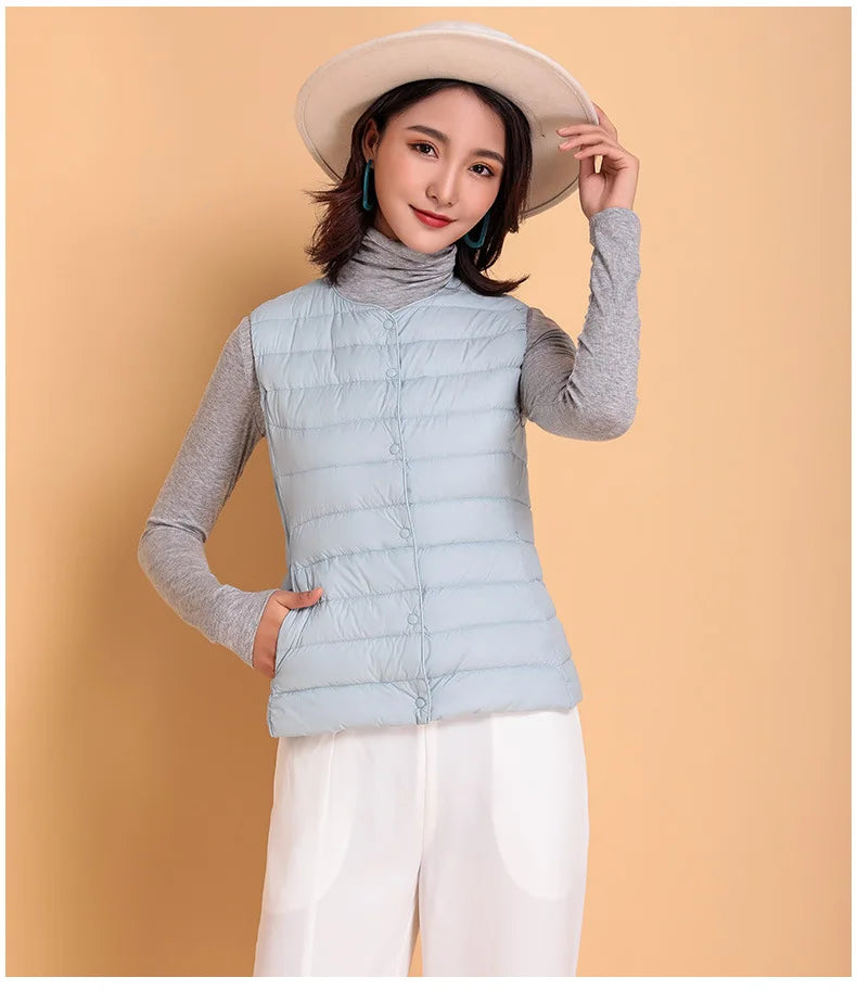 2023 Neuankömmlinge Herbst Winter warme Frauen ärmellose Daunen futter Taillen mantel weibliche ultraleichte weiße Enten Daunen weste Jacken.