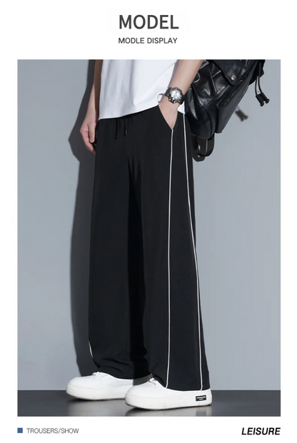 Summer ice silk thin section pants men's Hong Kong style loose splicing casual sports wide-legged pants elastic speed pants.