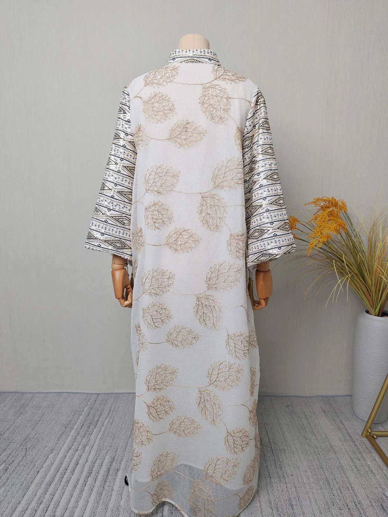 Muslim Women's Light Blue Islamic Embroidered Abaya with Gold Detailing Ideal for Formal Events in Middle East like UAE Saudi.