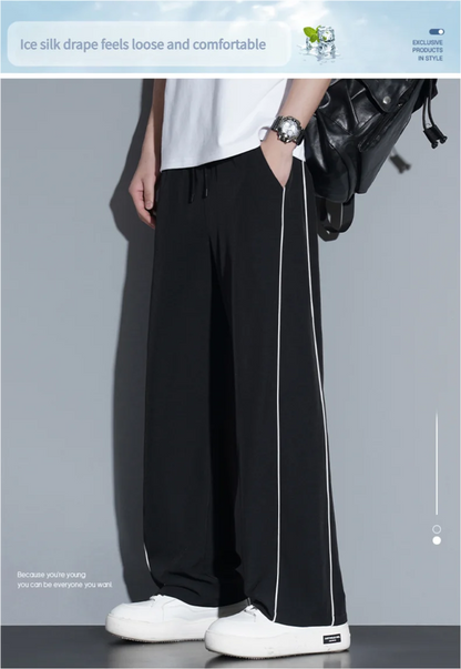 Summer ice silk thin section pants men's Hong Kong style loose splicing casual sports wide-legged pants elastic speed pants.