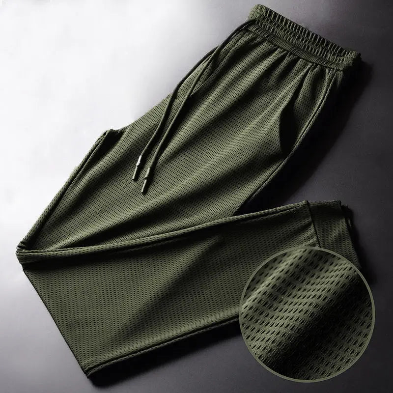 Men's Summer Ice Silk Pants Mesh Breathable Casual Thin Quick Dry Pants Loose Elastic Beam Feet Pants Sports Fitness Pants.