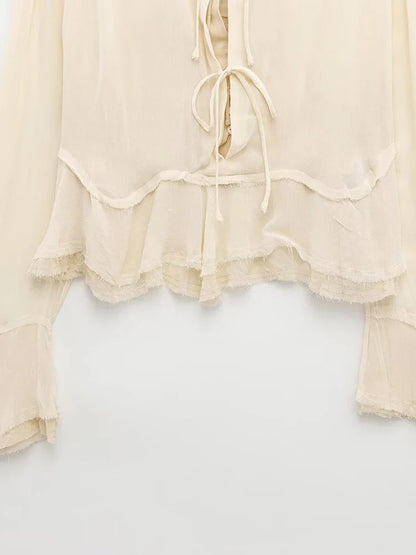 New spring women's clothing European and American style ruffled edge lace-up fake two-piece layered trumpet sleeve shirt.