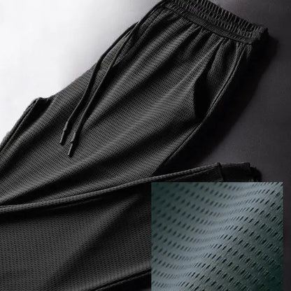 Men's Summer Ice Silk Pants Mesh Breathable Casual Thin Quick Dry Pants Loose Elastic Beam Feet Pants Sports Fitness Pants.