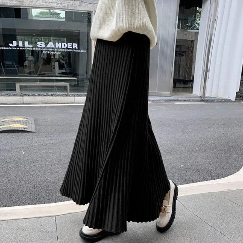 Knitted midi skirt women's A-line skirt high waist wide span mid length skirt.
