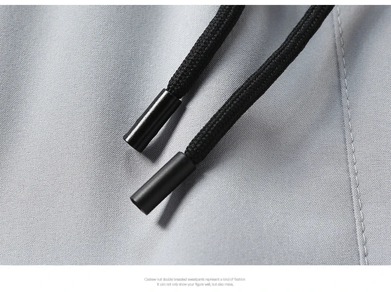 Summer ice silk thin section pants men's Hong Kong style loose splicing casual sports wide-legged pants elastic speed pants