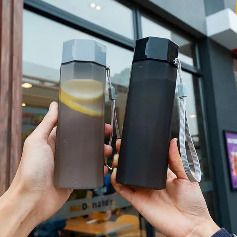 Portable Plastic Water Bottle Creative Matte Water Cup Outdoor Juice Leak-Proof Sports Bottle with Rope Travel Camping Bottles.