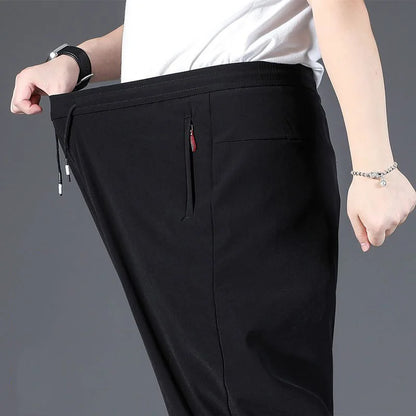 8XL Casual Pants Mens Straight Loose Trousers Men Clothing Elastic Waist Quick Dry Pants Summer Fashion Oversized Joggers Pants.