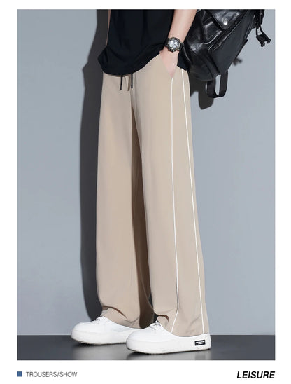 Summer ice silk thin section pants men's Hong Kong style loose splicing casual sports wide-legged pants elastic speed pants.